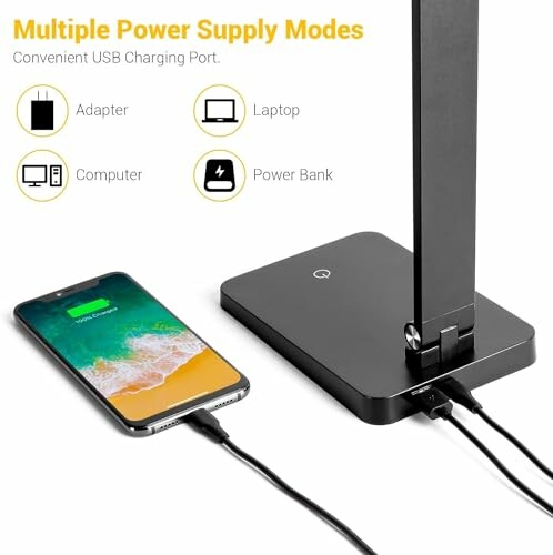 Desk lamp with USB charging port and smartphone connected