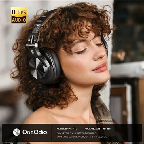 Woman wearing OneOdio Hi-Res headphones, model A70.