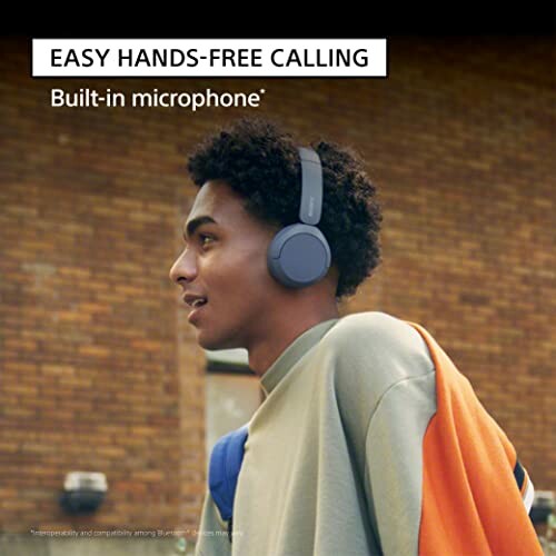 Man wearing headphones with text 'Easy hands-free calling, built-in microphone'.